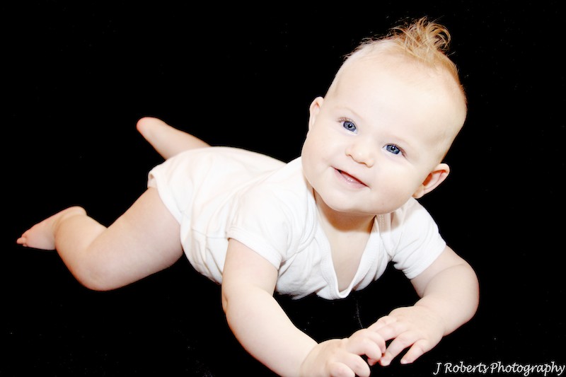 6 month old baby girl with big blue eyes - baby portrait photography sydney